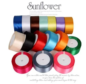 Detailed view of colorful satin ribbon rolls for DIY handmade flower crafts