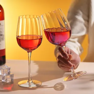 Luxury iridescent crystal red wine glasses with ribbed design for elegant home dining