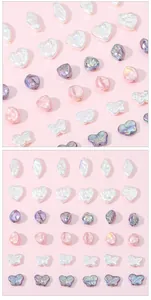Detailed view of iridescent Baroque faux pearl beads in heart and butterfly shapes
