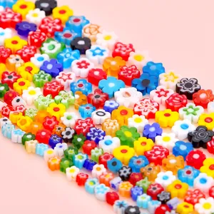 Detailed view of colorful millefiori glass flower beads for DIY jewelry making