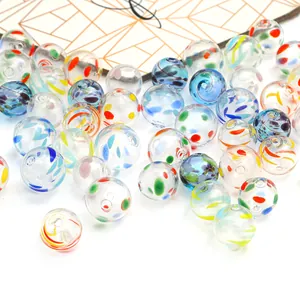 Close-up of colorful hand-painted hollow glass bubble beads for DIY jewelry