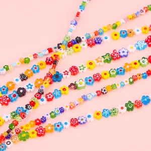 Close-up macro shot of colorful millefiori glass flower beads for handmade DIY jewelry making