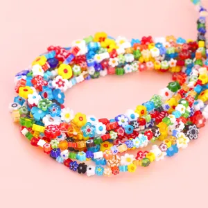 Close-up view of vibrant millefiori glass flower beads for DIY jewelry making projects.