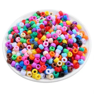 Multicolor acrylic pony beads in a white plate for DIY jewelry making