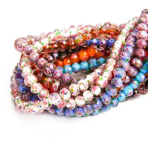 Close-up of faceted floral lampwork beads for DIY jewelry making in various colors