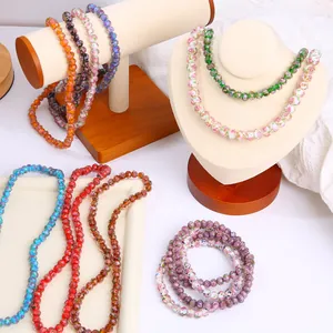 Colorful vintage faceted glass beads displayed for handmade jewelry and DIY projects