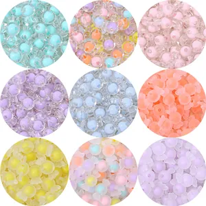 Detail showing various colors and textures of candy-shaped acrylic loose beads