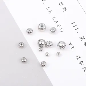 Detailed macro view of silver copper slider beads with silicone inserts for DIY jewelry