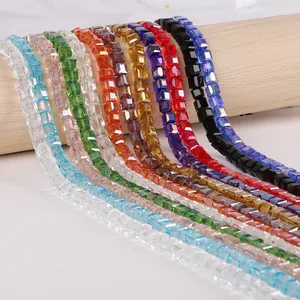 Detail view of 3mm square crystal beads in various vibrant colors for DIY jewelry making.
