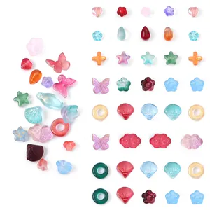 Cuentas de vidrio de colores con forma de mariposa y flor para accesorios de joyería DIY en rejilla