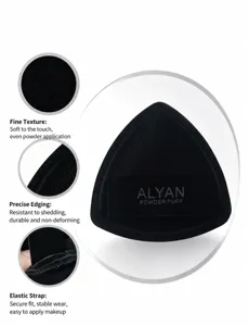 Macro detail view of a triangular black makeup powder puff showing Rubycell surface texture
