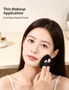 ALYAN black triangle makeup puff used by a model for seamless foundation application