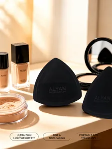 Close-up of black triangular powder puff with Rubycell texture for makeup