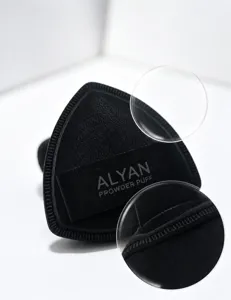 Detailed macro view of ALYAN black powder puff showing precision overlock stitching