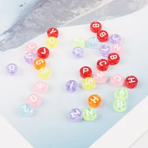 Detailed close-up of colorful 4x7mm acrylic alphabet beads for DIY jewelry crafts.