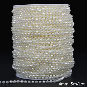 Detail view of 4mm cream white ABS imitation pearl chain on a spool, 5m length