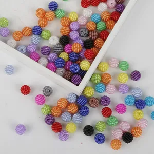 Close-up shot of multi-colored textured ABS berry beads showing intricate surface details and holes