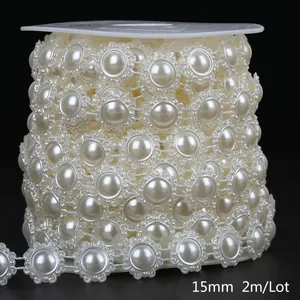 Macro detail of 15mm ABS imitation pearl lace chain on a reel for DIY craft projects