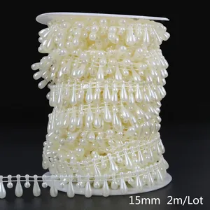 Detailed view of 15mm cream teardrop ABS pearl bead chain trim for DIY wedding decor.