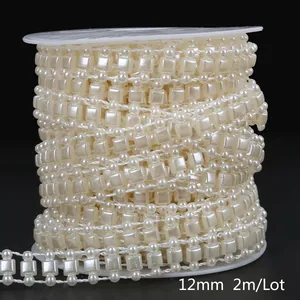 Detailed macro view of 12mm ivory ABS faux pearl bead chain spool for DIY crafts