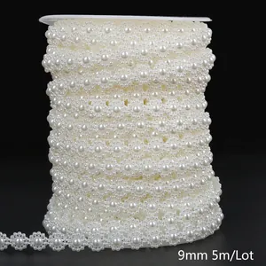 Close-up detail of off-white ABS imitation pearl lace chain, 9mm width in a 5m roll.