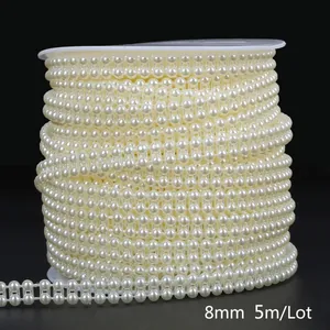 Close-up of 8mm cream white ABS imitation pearl chain on a 5m roll for DIY decoration
