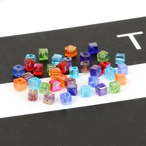 Macro detail of 3mm colorful faceted crystal glass square beads for DIY jewelry