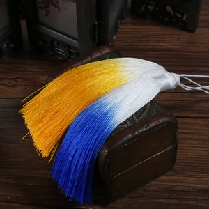 Close-up of 13cm gradient silk tassels in yellow and blue for fan decorations