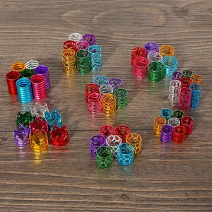 Close-up view of colorful hollow aluminum beads featuring crown and mesh patterns for DIY