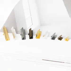 Detailed view of various sizes and colors of metal crimp ends for DIY jewelry making