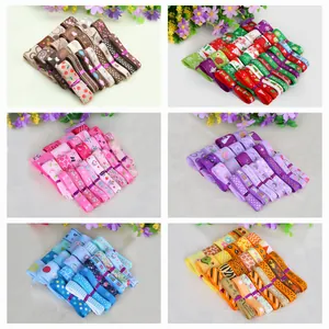 Variety of colorful printed polyester grosgrain ribbons in themed sets for DIY craft projects