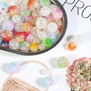 Detail shot of multi-colored ice-crackle acrylic beads for DIY handmade jewelry crafts.