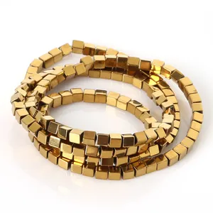 Detail shot of metallic golden hematite cube beads for handmade DIY jewelry making