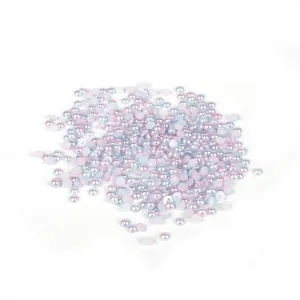 Detailed view of iridescent pastel ABS flatback half-round pearls for DIY crafts