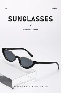 Lunettes de soleil œil de chat rétro avec monture noire et bordure dorée
