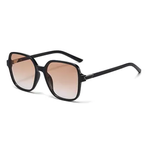 Classic oversized square sunglasses for women with black frames and gradient brown lenses