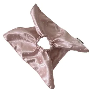 Elegant pink satin polka dot scrunchie with bow scarf design for stylish hair styling