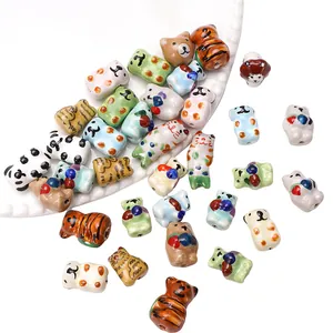 Hand-painted animal ceramic beads for DIY jewelry making, including cats and bears