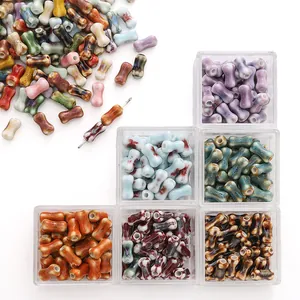 Macro view of multi-colored hand-painted ceramic bone beads for DIY jewelry making