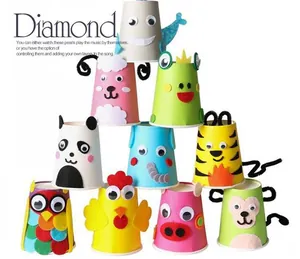 Close-up of adhesive wiggle eyes used to decorate colorful animal-themed paper cups