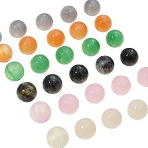 Assorted colorful resin cat eye beads for DIY handmade jewelry making on white background