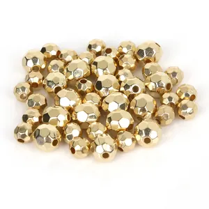 Macro view of faceted gold metallic CCB beads for handmade jewelry making projects.