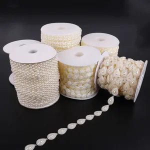 Macro view of various styles of white faux pearl bead chain rolls for DIY jewelry making