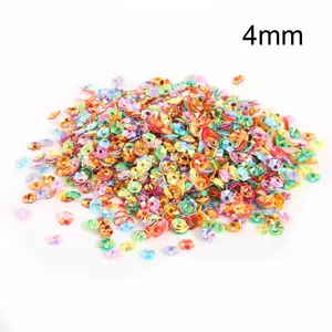 Macro detail of 4mm colorful iridescent flower-shaped sequins for DIY handmade jewelry
