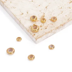 Detailed macro view of 18K gold plated copper silicone spacer beads for jewelry