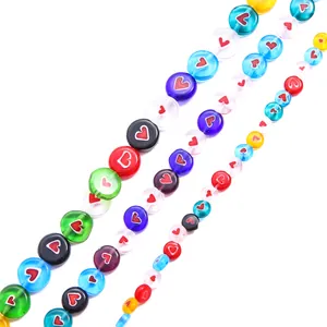 Close-up of colorful millefiori glass beads with heart patterns for DIY jewelry