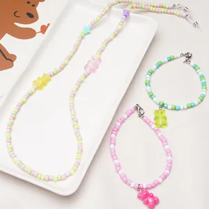 Detail of 11x21mm colorful acrylic gummy bear charms on pastel beaded necklaces and bracelets