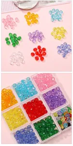 Assorted 6mm acrylic faceted beads in a clear storage organizer for DIY jewelry
