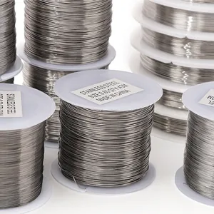 Close-up of multiple stainless steel jewelry wire rolls for DIY crafting and beading