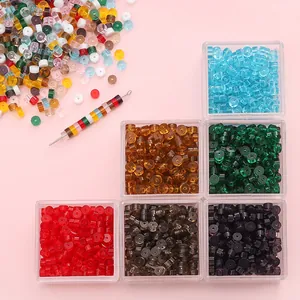 Detailed macro view of 2x4mm colorful flat round glass beads for DIY jewelry making sets
